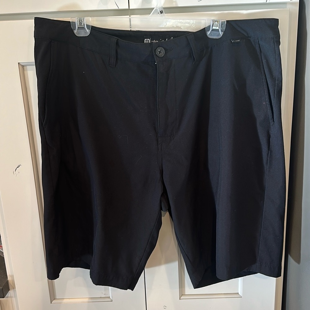 Travis Mathew Men’s black golf shorts.